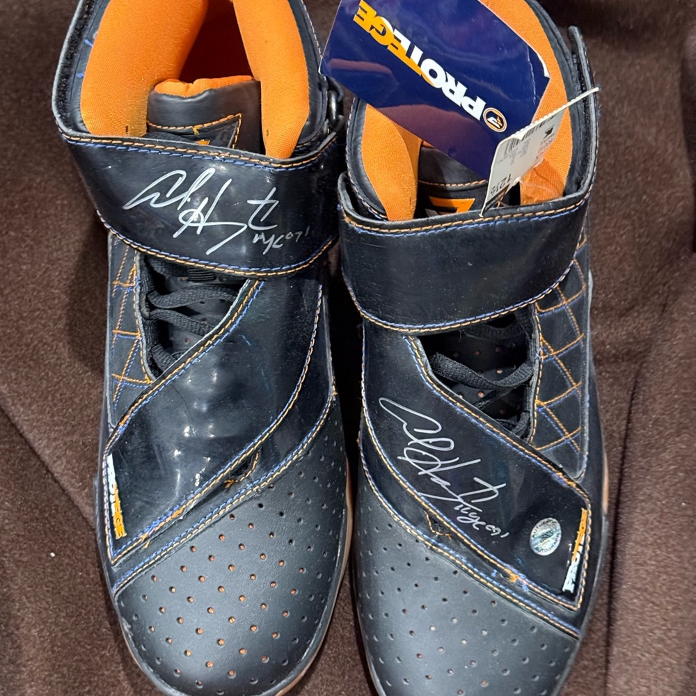 Black and Orange Men's protege sneakers signed by NBA player Al Harrington